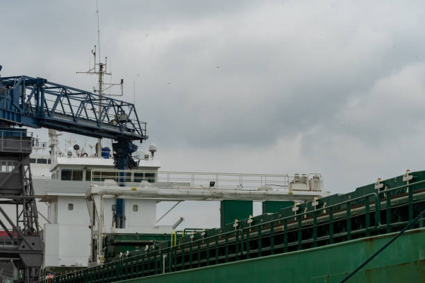 istock A crane connected to a ship at port 1444447398