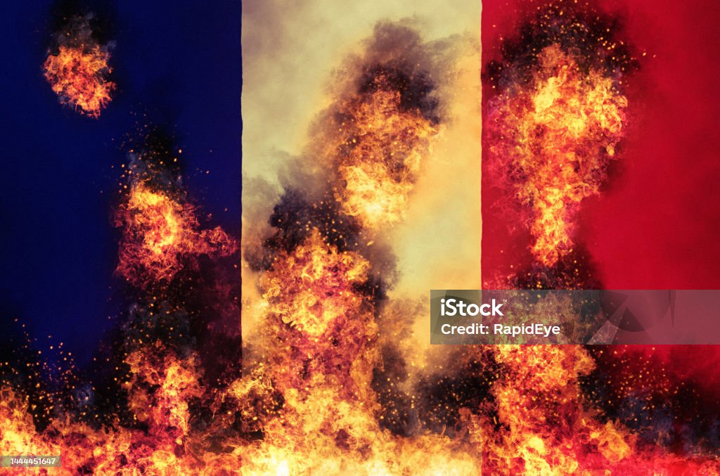 French flag burning Fire and flames consume the national flag of France. France Stock Photo