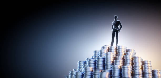 istock silhouette business man on many coins 1444454724