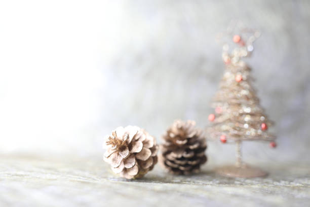 pine cone and mini golden Christmas tree
