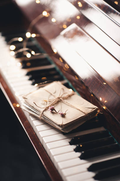 istock Piano keys with glow lights and old lettes 1444460396