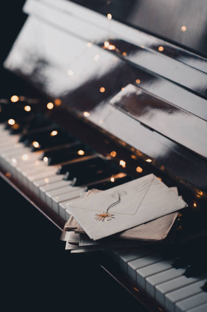 istock Piano keys with glow lights and old lettes 1444460521