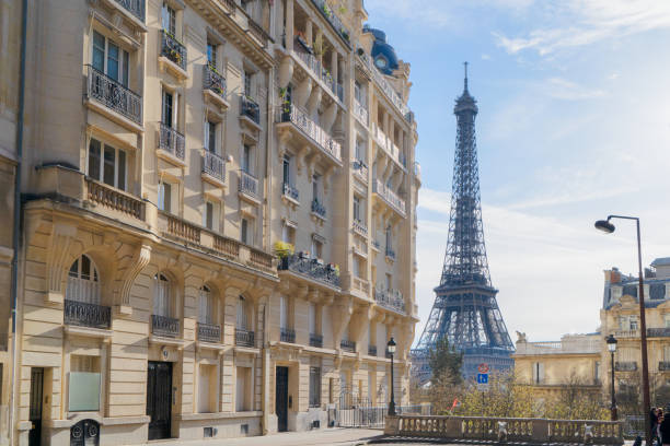 istock eiffel tour and Paris street 1444462293
