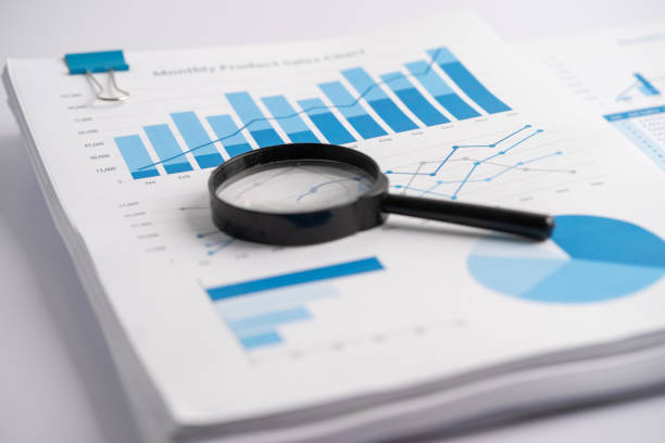 istock Magnifying glass on charts graphs paper. Financial development, Banking Account, Statistics, Investment Analytic research data economy, Stock exchange trading, Business office company meeting concept. 1444464601