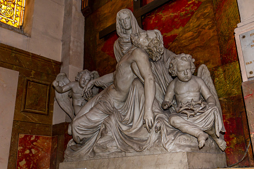 Paris, france, november 10, 2022 : statues by french sculptor Lambert-Sigisbert  of Saint Roch church, in Paris, France, 18th century