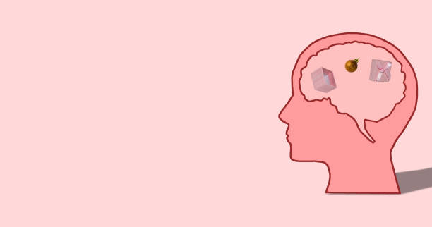 istock pink head in whose brain is a package from which an ornament falls out, next to the head copy space, pink background, creative art holiday concept 1444477240