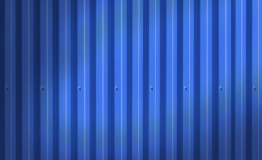 Fence made of metal panels a blue color outdoors