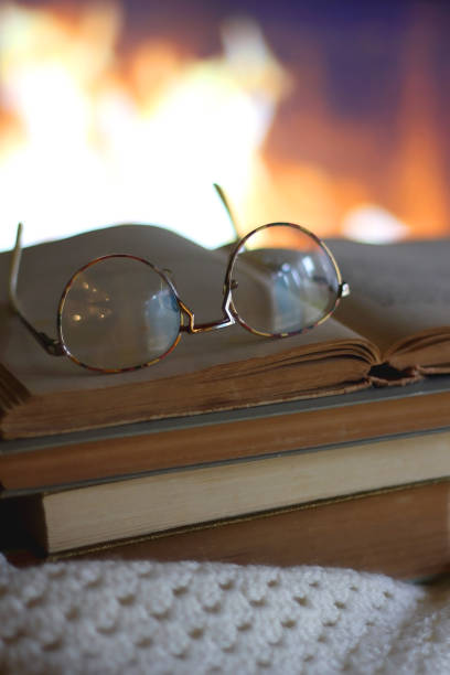 istock Books, Glasses, Blanket and Fireplace 1444484332