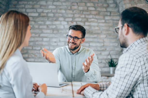 istock Group of business persons talking in the office. 1444490426