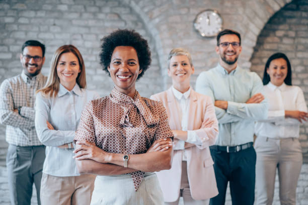 istock Confident businesswoman and her team. 1444490635