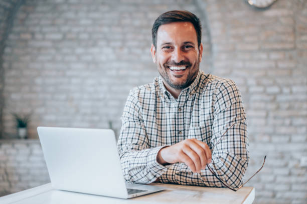 istock Successful businessman in modern office working on laptop. 1444490742