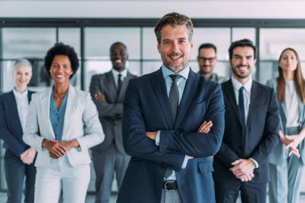istock Confident businessman and his team. 1444490847