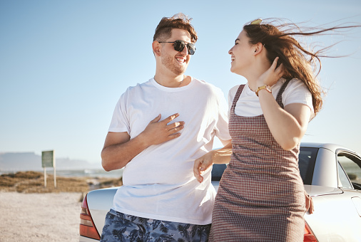 Happy, couple and travel for love on road trip vacation in relationship happiness together for bonding in the outdoors. Man and woman enjoying summer holiday in romance and traveling in South Africa