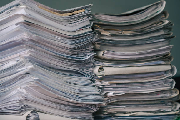 istock Stack of blank papers with binder clips on wooden table indoors. Workplace. Many documents, contracts, legal agreements, papers on work table. Concept of business, working, job 1444492029