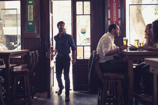 istock Friend watching soccer, drinking beer in the bar 1444493555