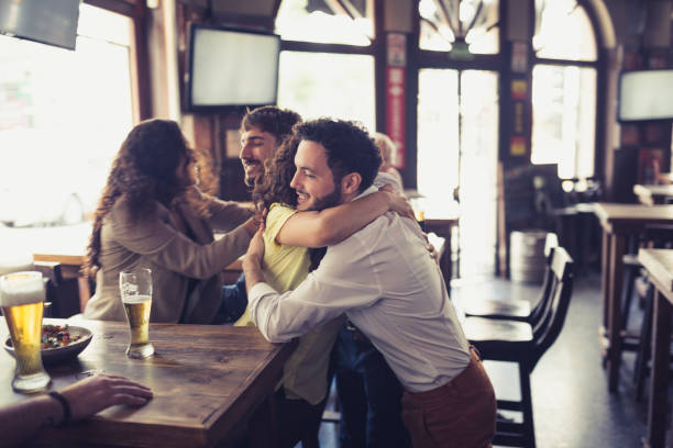 istock Friend watching soccer, drinking beer in the bar 1444493564