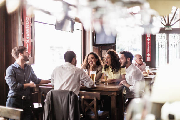 istock Friend watching soccer, drinking beer in the bar 1444493594