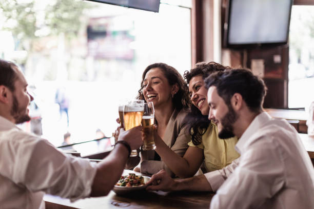istock Friend watching soccer, drinking beer in the bar 1444493598