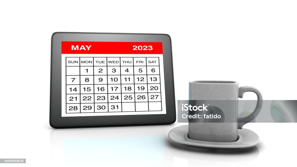 May 2023 calendar on Tablet PC and Coffee Cup May Day - International Workers Day Stock Photo