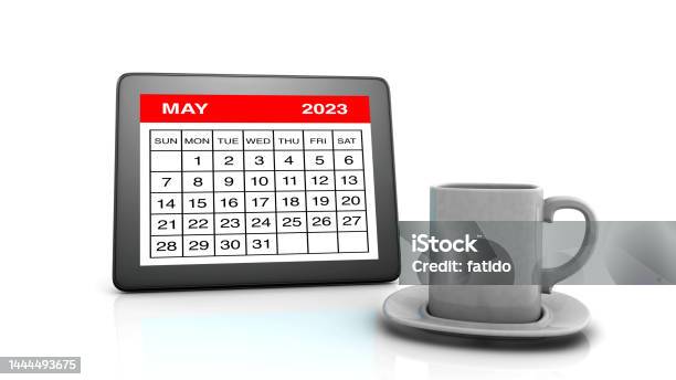 May 2023 Calendar On Tablet Pc And Coffee Cup Stock Photo - Download Image Now - May Day - International Workers Day, 2023, Beginnings