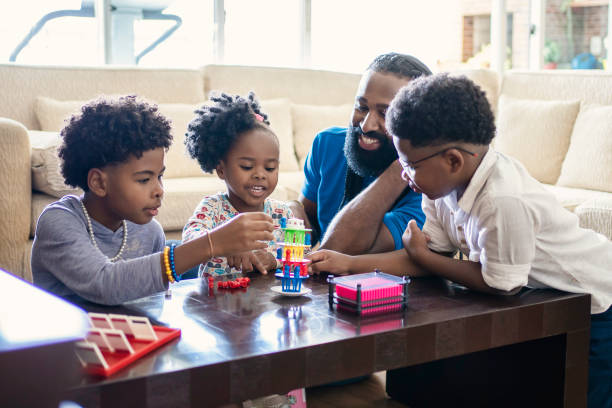 istock Father playing table games with kids at home 1444496454