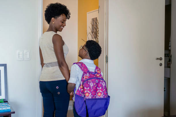 istock Mother preparing son to go to school 1444496535