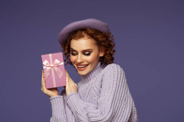 istock Beautiful emotional woman holding a gift 1444497283
