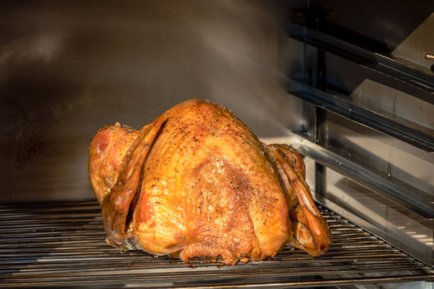 istock Roasted turkey in a Barbecue smoker 1444501857
