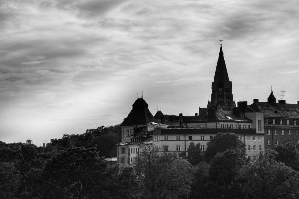 istock Low angle view of buildings against cloudy sky 1444502608