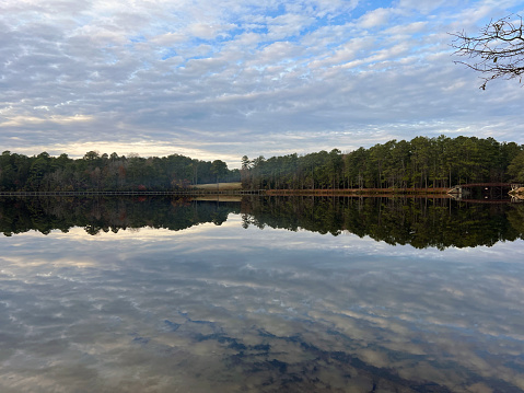 Sunburst reflected in the clear water of Juniper Creek in Ocala National Forest.