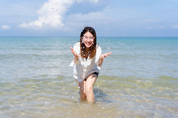 istock Pretty girl walking at the beach. 1444506464