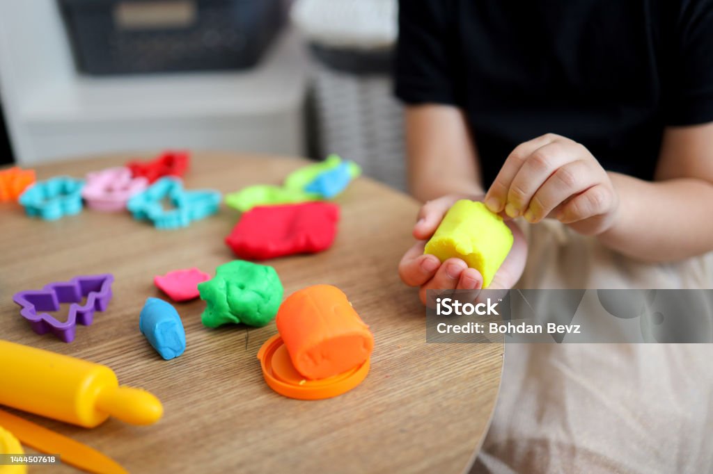The child plays and sculpts plasticine. Online master class The child plays and sculpts plasticine. Online master class. Animal Stock Photo