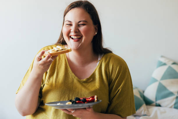 Plus Size Woman Enjoying Her Breakfast