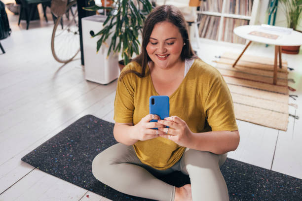 istock Overweight Woman Texting On Smartphone 1444508213
