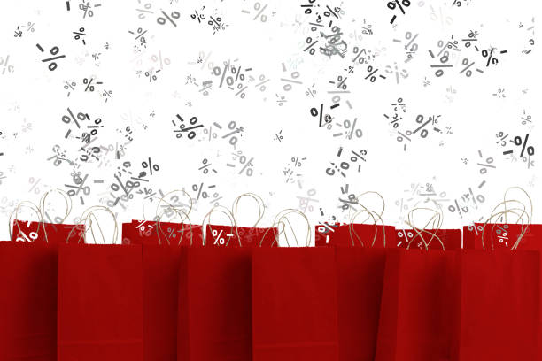 discounts falling into shopping bags stock photo