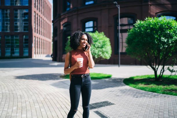 istock Black woman making call on cellphone 1444516984
