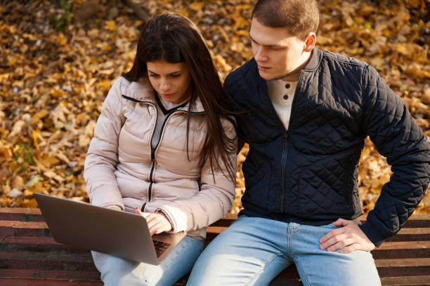 istock Focused young people are reading something in a laptop 1444524889