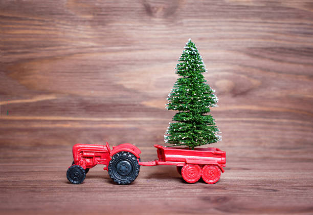istock Toy tractor with a miniature Christmas tree 1444526641