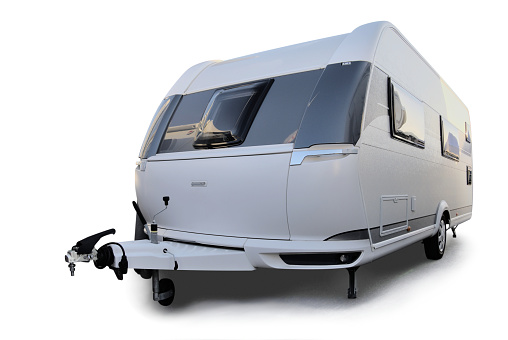 A caravan isolated on white background with a drop shadow.