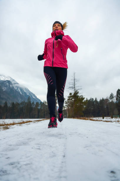 istock Woman running in winter 1444532899