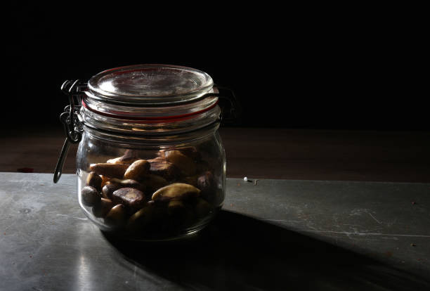 cashew nuts stored inside the glass jar with side view