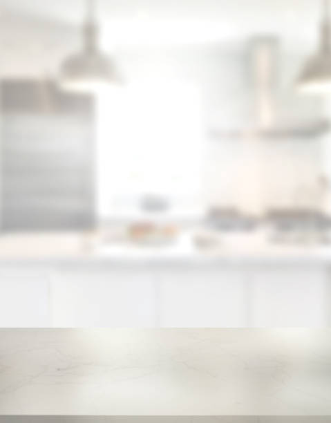 istock Countertop. Empty marble desk on blurred kitchen window for product presentation. Stylish marble table top with copy space for your design at blurry kitchen. 1444542194