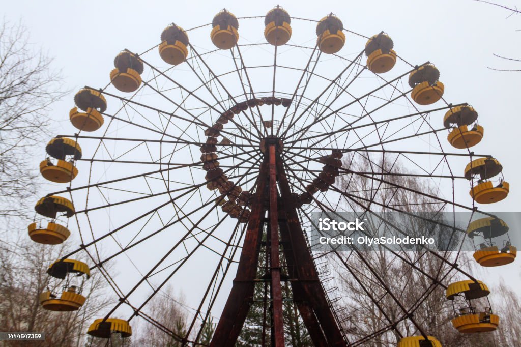 Abandoned Ferris Wheel in the amusement park of ghost town Pripyat in Chernobyl Exclusion Zone, Ukraine Pripyat City Stock Photo