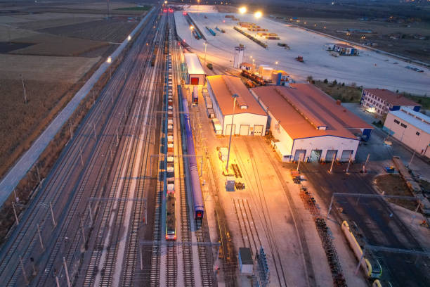istock Shipping containers and train in logistics center, drone view 1444550885