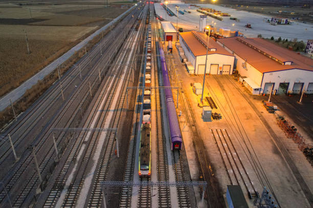 istock Shipping containers and train in logistics center, drone view 1444550925