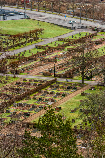 istock Grid of graves at a gaveyard viewed from a small hill. 1444551178