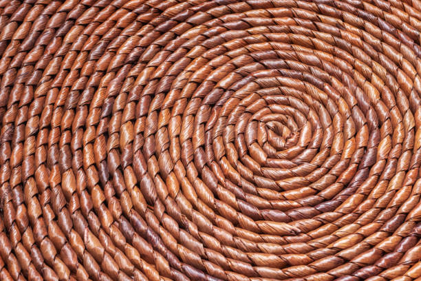istock Concentric circles of a straw decorative placemat. Natural table mat, full frame background 1444557400