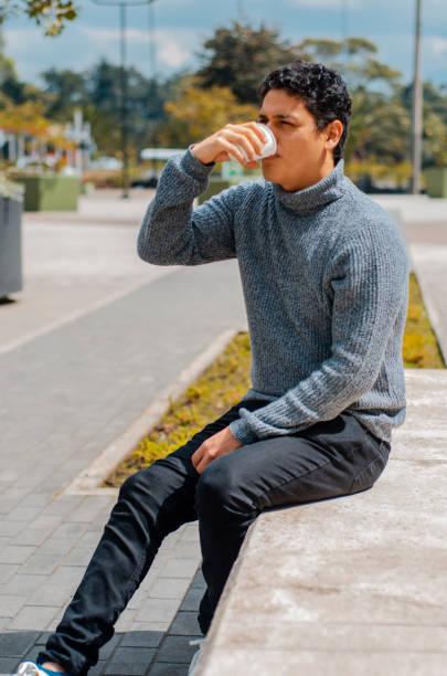 istock Man drinking coffee in the street and copy space 1444558398