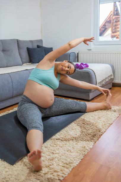 istock Pregnant woman training at home 1444558924