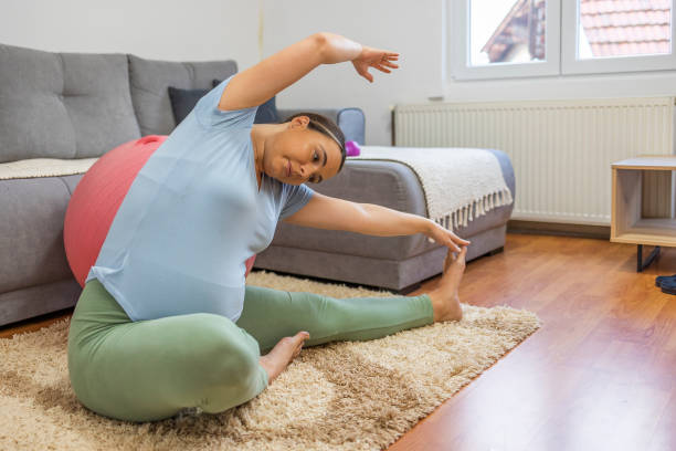 istock Pregnant woman training at home 1444561267